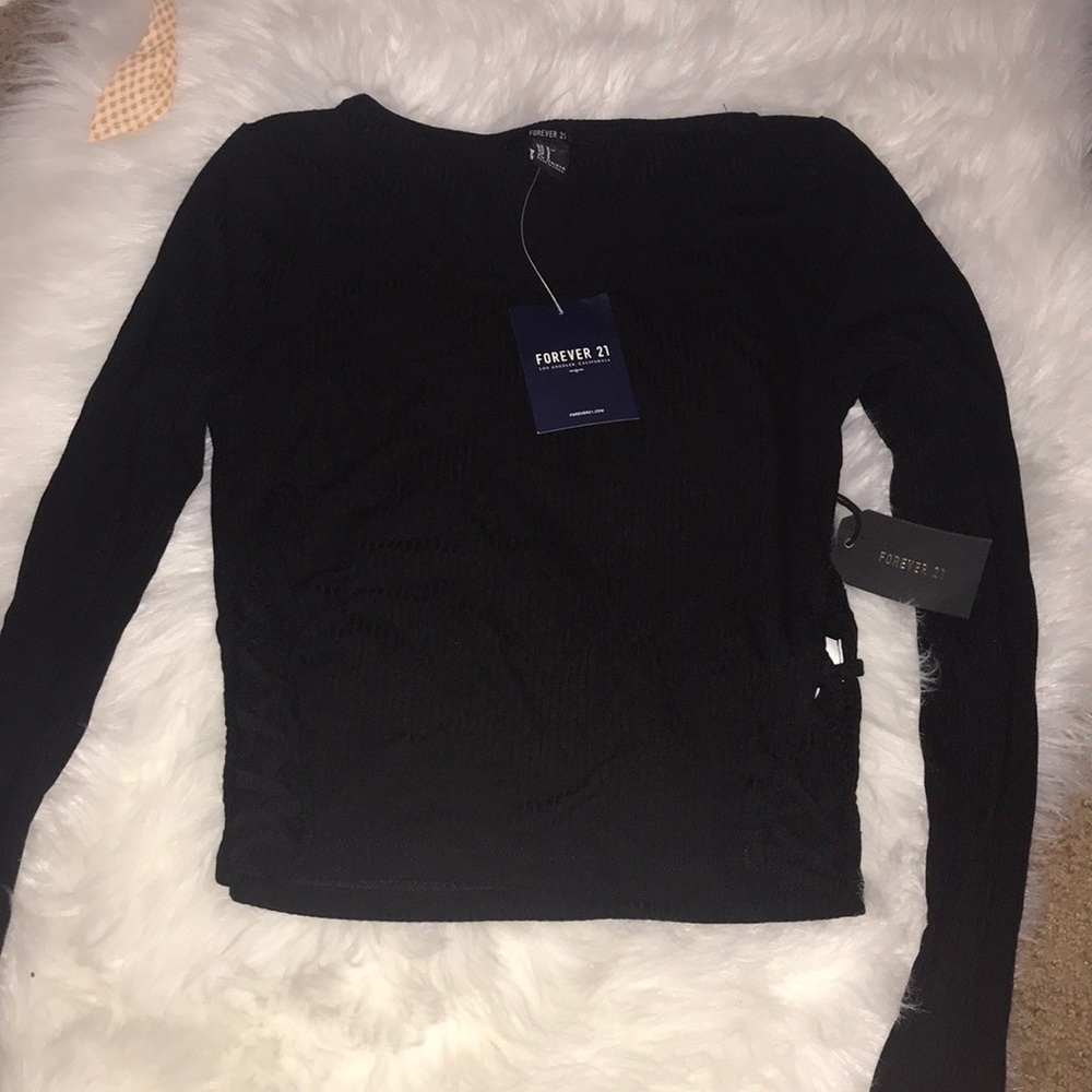 Long sleeve black crop top.